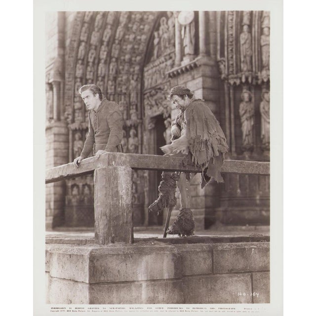 Original black-and-white lobby card for the film "The Hunchback of Notre Dame" (1939) featuring Charles Laughton and...