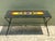A striking example of mid-century modern artistic design, this vintage geometric painted wood table combines functional...