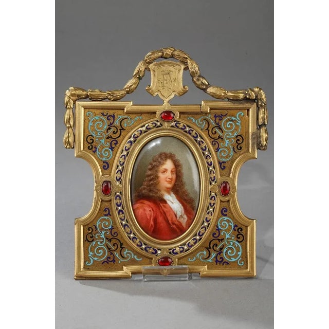 Pair of porcelain and enamelled portraits featuring a man and a woman of the 17th century. It is most likely a portrait of...