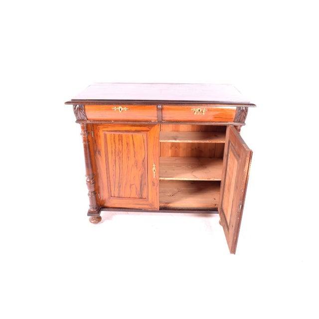 English sideboard, with a beautiful wood grain. Features two drawers and two doors. Plenty of storage space with two...