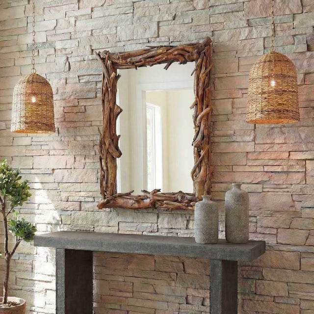 This unique mirror features a hand-assembled frame from salvaged teak in its natural finish. It provides organic texture,...