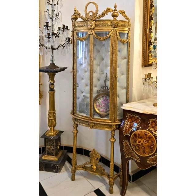 Create a breathtaking focal point with this magnificent French Louis XVI curio display cabinet. Beautifully handcrafted,...