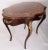 French 19th century Louis XIV style mahogany marquetry side or accent table with a turtle-shaped top, elaborate ormolu...