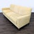 This Room and Board 3-seat sofa features a clean, modern design with a light beige fabric upholstery and sturdy wooden...