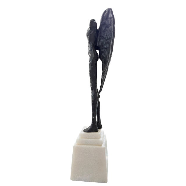 A striking sculptural statement by Global Views, this cast iron winged torso captures the timeless beauty of fragmented...