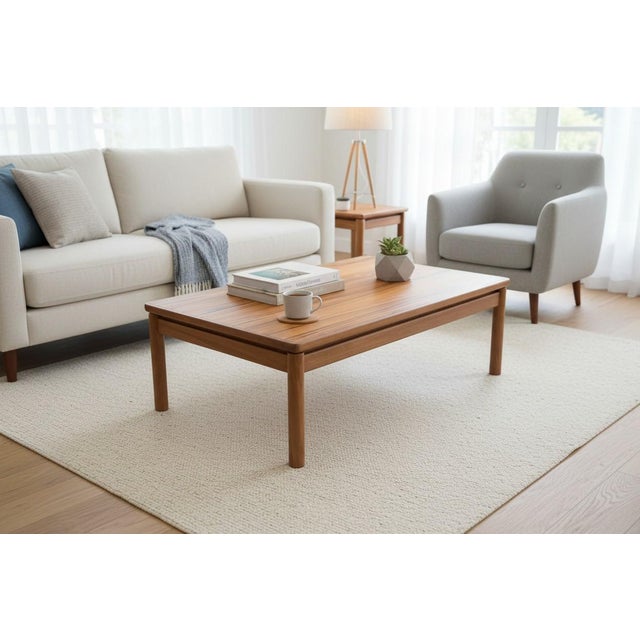This beautiful Danish Modern coffee table showcases clean lines, balanced proportions, and timeless Scandinavian design....