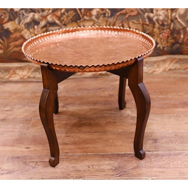 On trend mahogany and copper coffee table Look is very bohemian chic and we date this to circa 1930. Dimensions in inches...