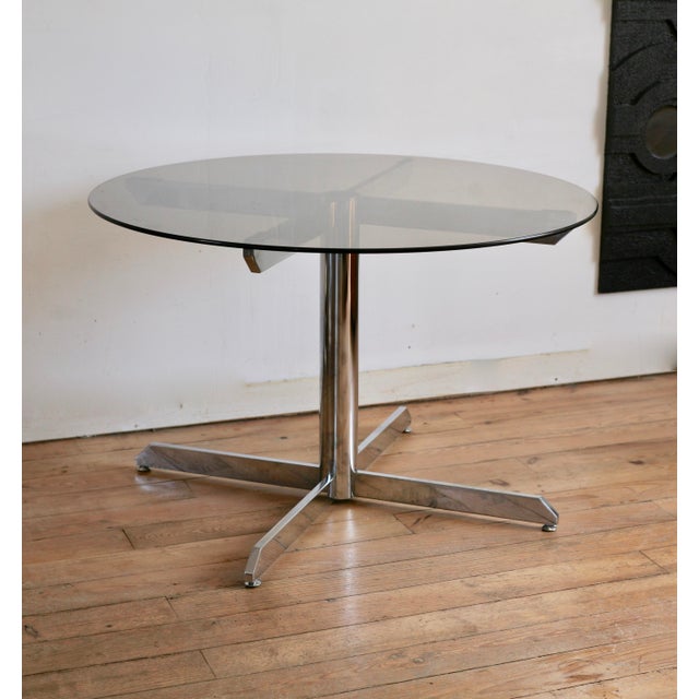 1970s table. Attributed to Florence Knoll Roche Bobois. Glass and steel. Minor scratches on the glass and metal. In good...