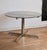 1970s table. Attributed to Florence Knoll Roche Bobois. Glass and steel. Minor scratches on the glass and metal. In good...