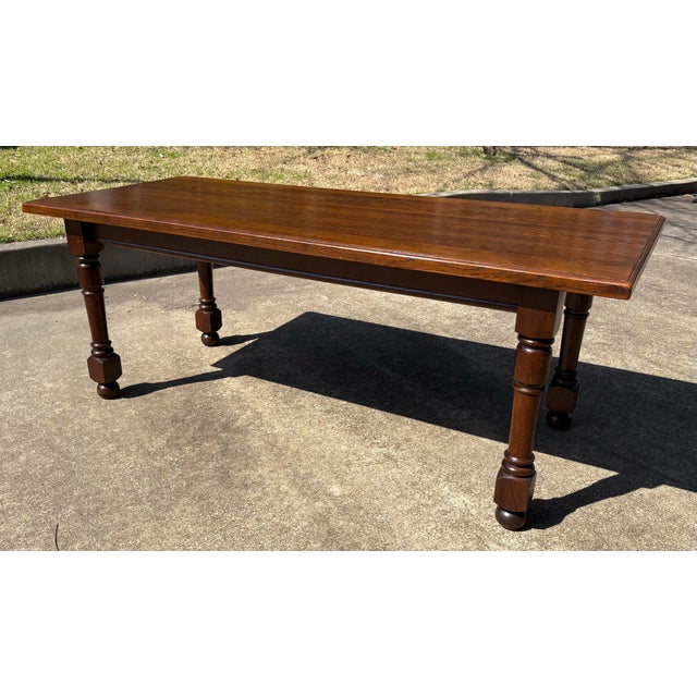 Lovely dark French country dining table with solid top and turned legs.