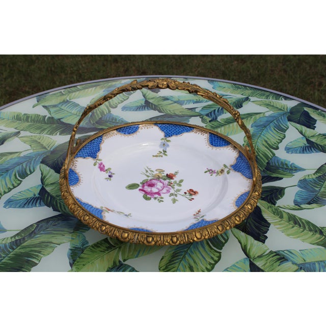 I've been a devoted fan of handpainted porcelain for many years and love pieces that are combined with gilt bronze, as...