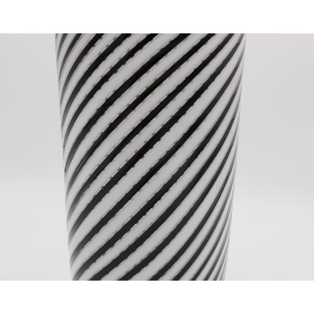 Mezza Filigrana' Murano glass vase by Dino Martens. Clear glass, fused ribbons, white and dark purple, base with fused...