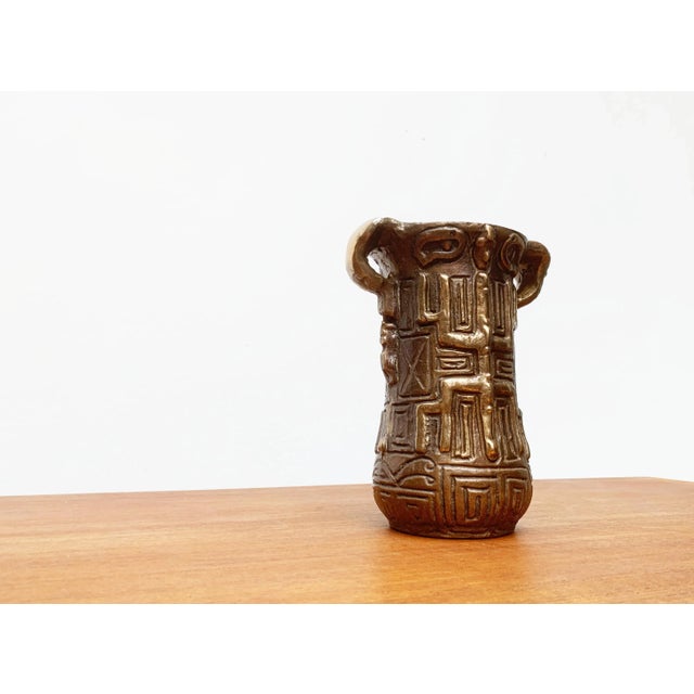 Very heavy bronze vessel. The vessel shows ornamental decorations with traditional designs. This piece has an attribution...