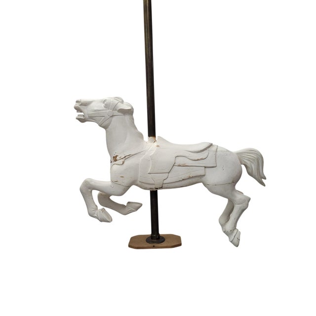 This carved carousel horse is an exceptional turn-of-the-century piece that sits at the intersection of American folk art...