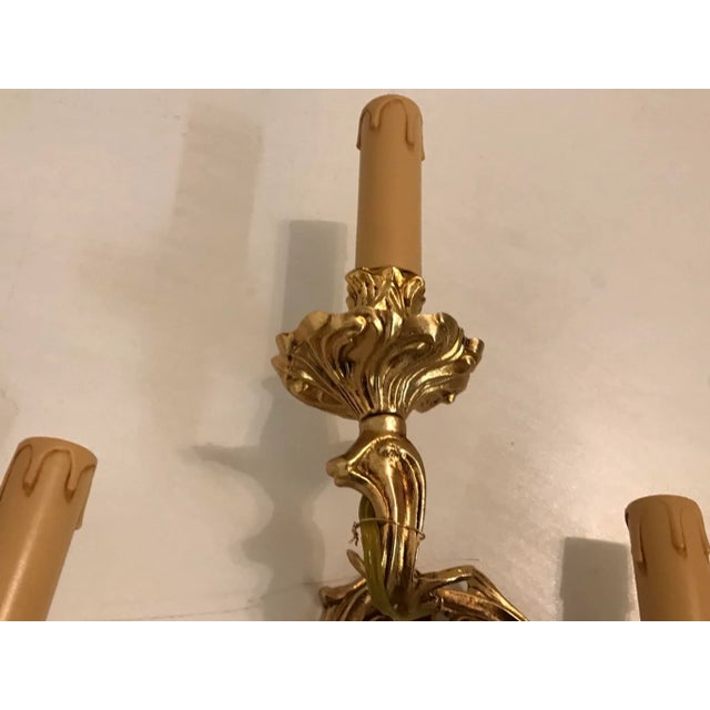 Each sconce features 3 lights requiring E14 light bulbs. European Plug (up to 250V).The wiring of this item may be...