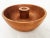 Offered is a medium sized hand turned teak wood nut bowl. There are too many discussions on what the raised center...