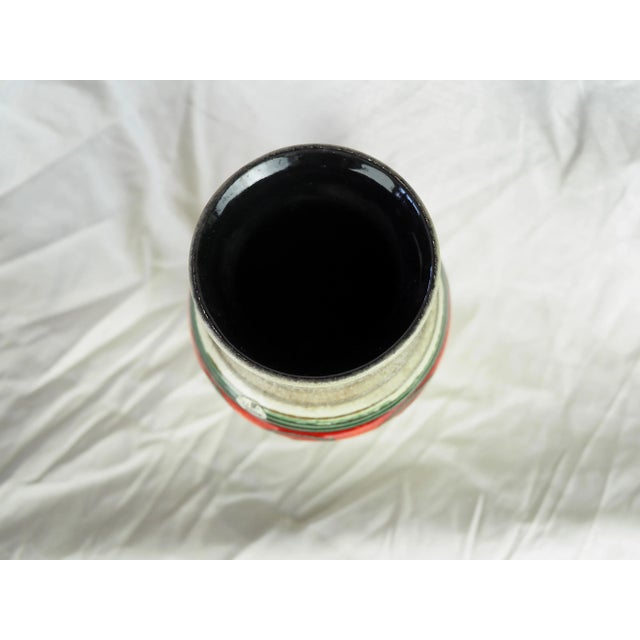 Large frieze vase with green and red circle similar to an eye, beige spiral background, seventies vibe. Very graphic and a...