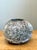 This vintage handcrafted earthenware vessel embodies the timeless appeal of artisan ceramics with its organic silhouette...
