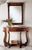 Handcrafted in Italy, this console table features walnut burl veneers, a curved front, and a single drawer with brass...