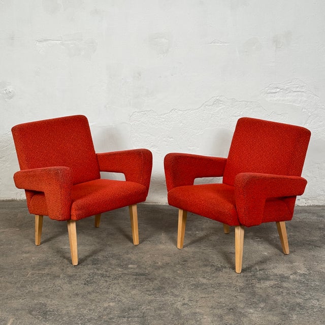 This striking pair of Czechoslovakian armchairs is a quintessential example of mid-century modern design from Eastern...