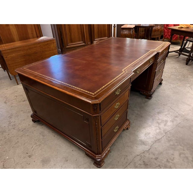 Mid-20th-century mahogany partners executive desk in the Chippendale style, dating to circa 1950s and designed to...