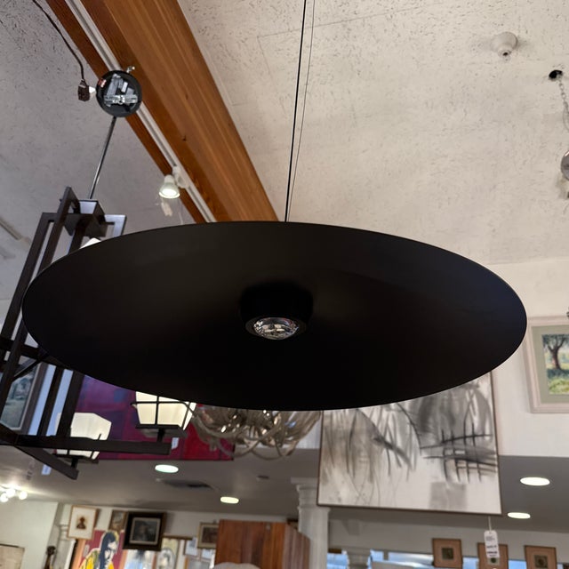 Design Plus Gallery presents a Saucer Pendant in Matte Black. The modern lighting piece is an elegant decorative touch for...