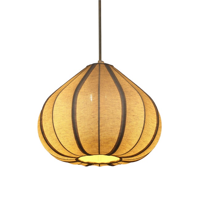Transform any room into a haven of calm with the Zubeda Pendant Lamp. Its teardrop shape and flowing curves bring a...
