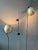 Aluminium space age eyeball floor lamp with double swing arms. The swivel arms carrying the shades can move up and down...