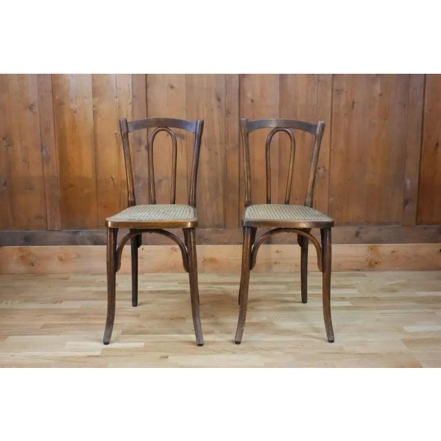 Pair of bistro chairs in the style of curved wood Thonet chairs. Indeed, Michael Thonet has worked enormously in the...
