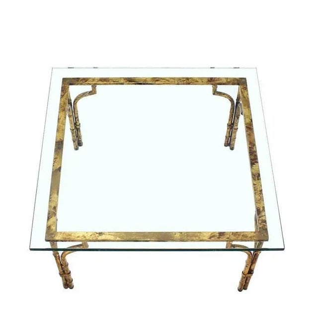 Nice Mid-Century Modern thick glass top gilt base coffee table. Perfect for the family room.