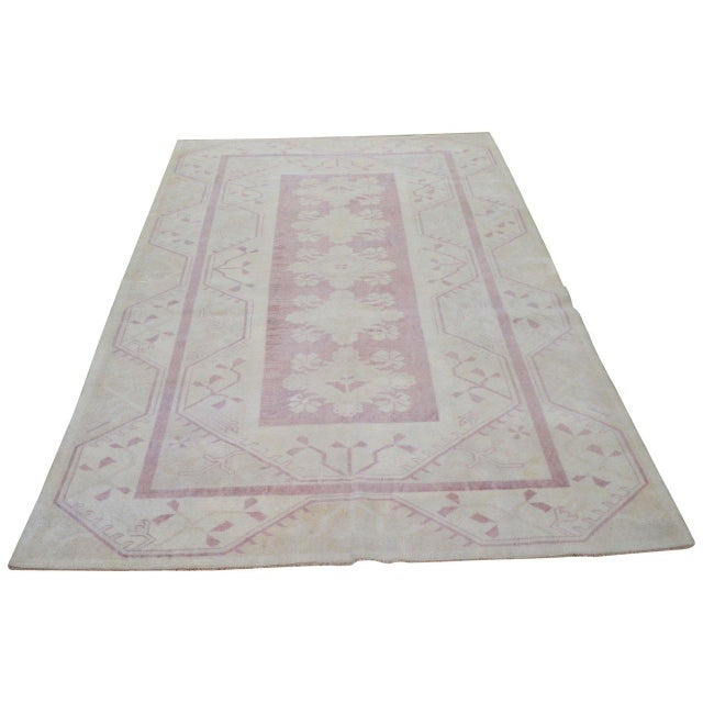 Hand-knotted with care using traditional rug-making techniques, this wool rug blends timeless craftsmanship with a modern...