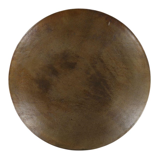 Antiqued brass finish aluminum round bistro table with unique stacked ball design pedestal base. Each table may vary in...