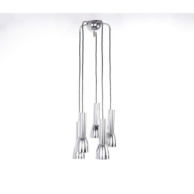 Cascade (waterfall) pendant lamp from the 1960s. The lamp features 5 shades and a chrome-plated metal ceiling...