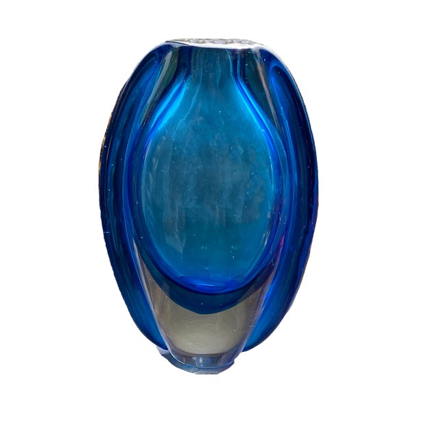 Beautiful blue art glass vase. 8.75” High x 5.5” Wide x 1.75” Deep