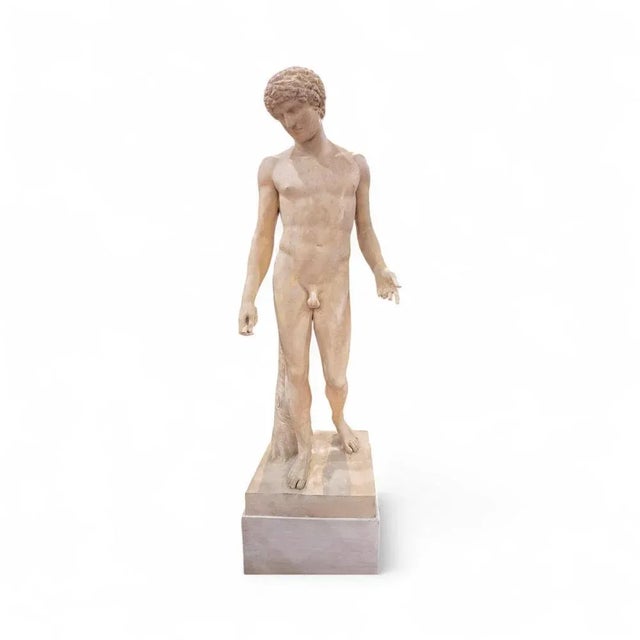 This impressive 19th-century plaster sculpture depicts a classical Greek figure and was crafted in a French atelier....