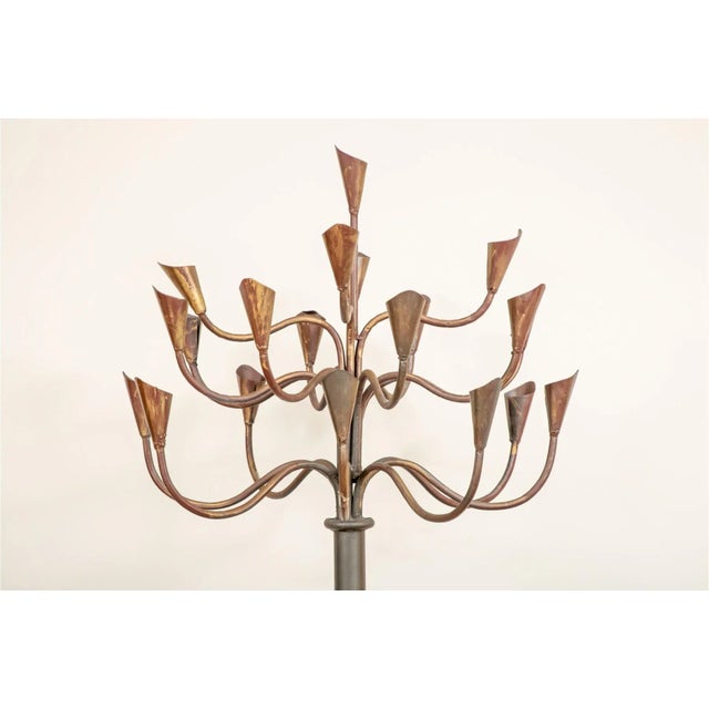 Stunning Midcentury French brass and iron 20 arm floor candelabra with gorgeous conical candle holders supported by a...