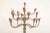 Stunning Midcentury French brass and iron 20 arm floor candelabra with gorgeous conical candle holders supported by a...