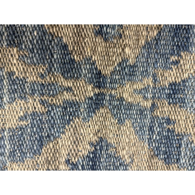 Design Plus Gallery presents a 4ft 4in x 8ft 11 in Flat Weave Runner Rug. The rug is from Tribal India and has a wonderful...