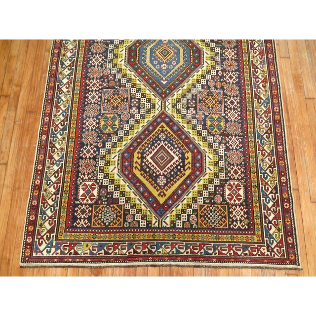 A rare size, authentic one-of-a-kind handmade late 19th century Caucasian wide gallery size runner. Measures: 4'9" x 10'6".