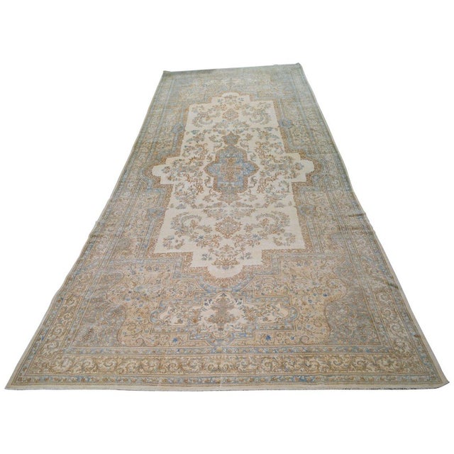 Hand-knotted with care using traditional rug-making techniques, this wool rug blends timeless craftsmanship with a modern...