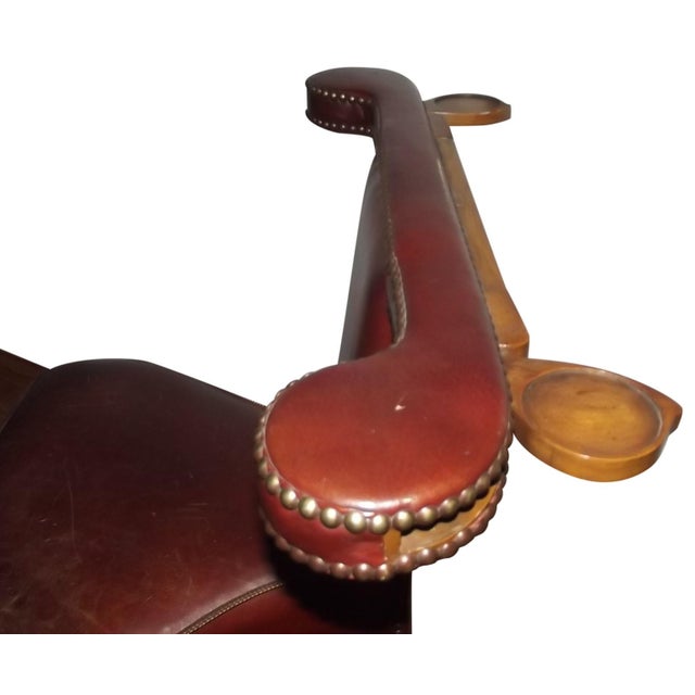 Antique English reading chair or "cockfighting" chair. This piece has great detail and design. It features a chair...