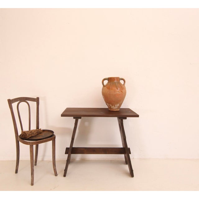 Small Spanish side table or side table from the 2nd half of the 20th century. Solidly made of stained softwood. Consisting...