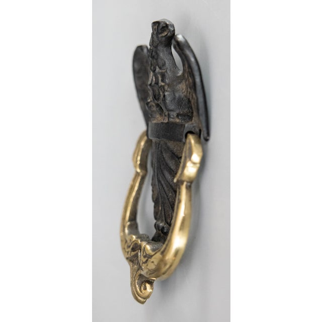 A fine antique American Federal eagle black cast iron and brass door knocker. This regal door knocker is nicely cast,...