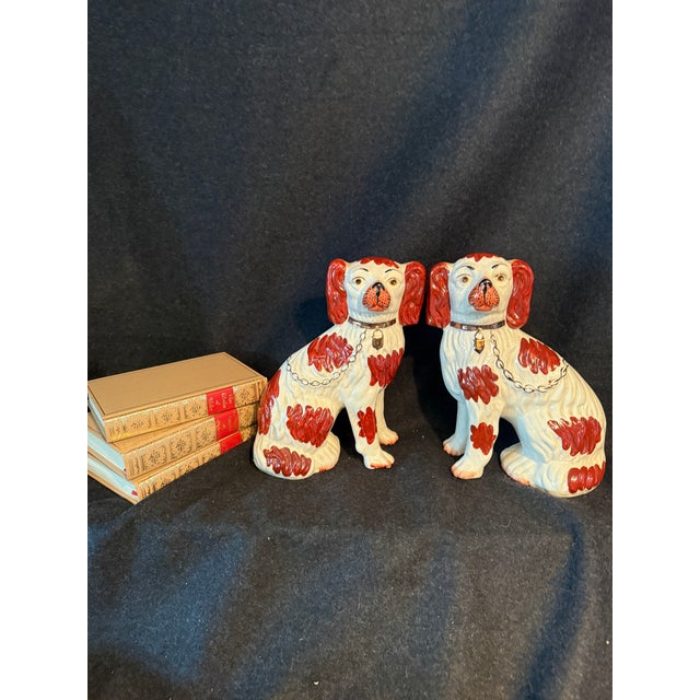 Pair of spaniel mantle dogs. In good condition. 11” tall x 8” long 4” wide