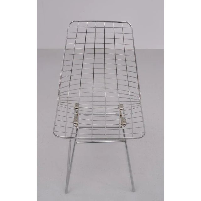 Very nice Chrome on Steel wire chair by Pastoe 1960s . seating height 46 cm. I have official proof of authenticity such as...