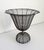 A charming and rustic wire planter or compote with a pedestal base and an urn-style basket. French-made, circa late 1800s...
