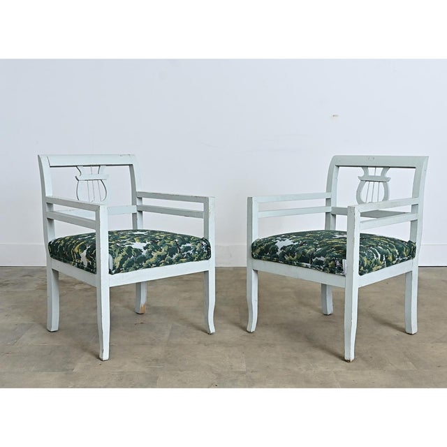 A pair of Swedish Biedermeier chairs from the 19th century, updated more recently in a pale blue painted finish recalling...
