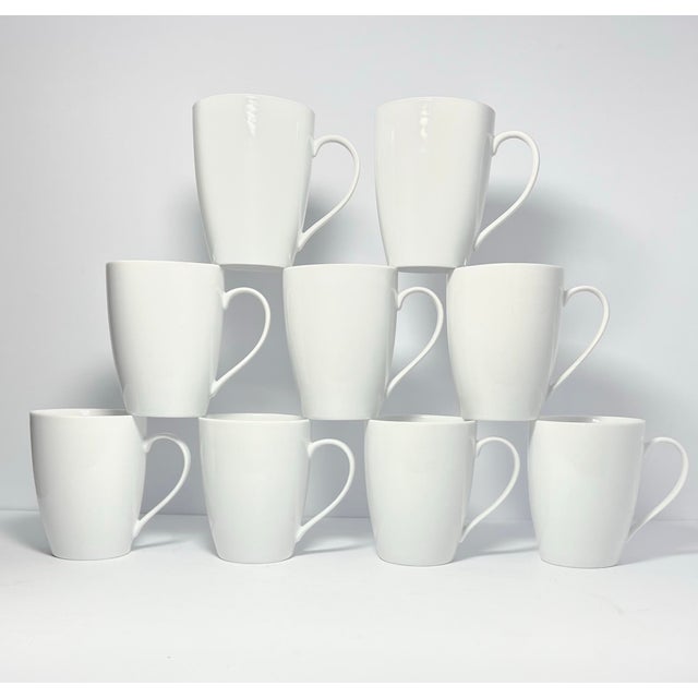 Crate & Barrel “Aspen” Set of 9 White Porcelain Mugs 4 1/2” 15oz Good condition. No chips, cracks, or fleabites. Length...