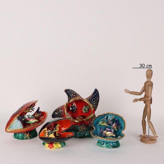 Group of eight marine-themed sculptures in polychrome ceramic. Some of them are prepared for electrification. Imprinted or...