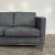 Mid Century Modern Dux Loveseat that has been recently reupholstered in a super soft blueish grey fabric. The fabric...